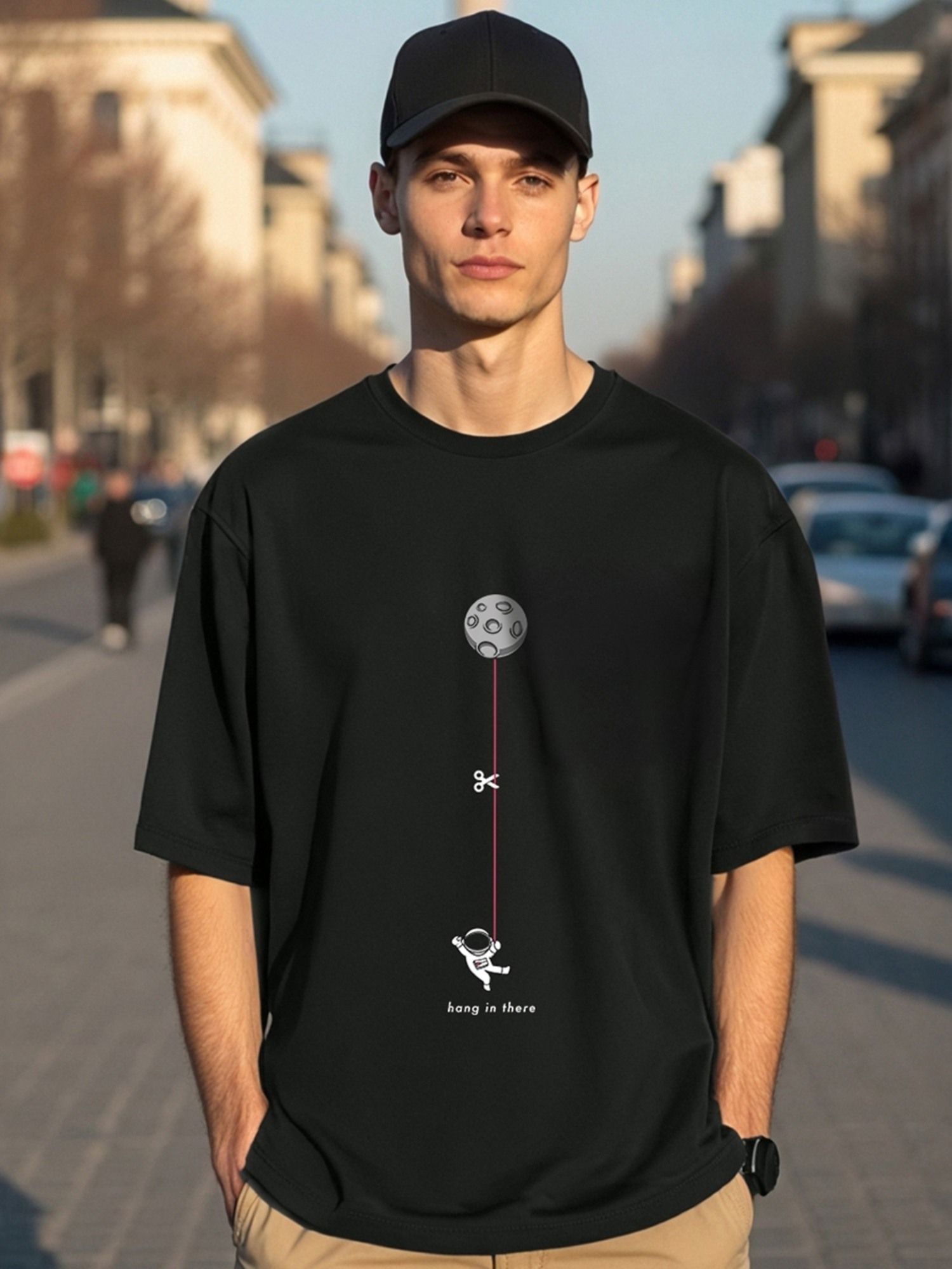 Bewakoof Men's Black Hangin Astronaut Graphic Printed Oversized T-shirt